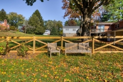 wood crossbuck fence with wire mesh in Fallston, MD