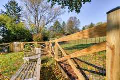 wood crossbuck wire mesh installed by Excel Fencing