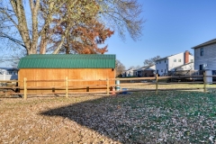 Pressure treated wood split-rail fence installation