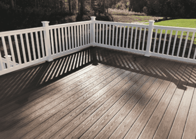 Brown deck with white handrails