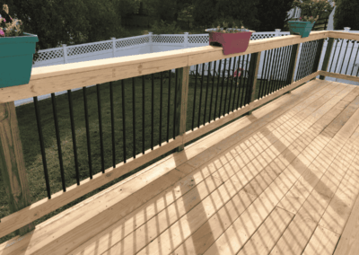 Pressure treated deck with aluminum handrails