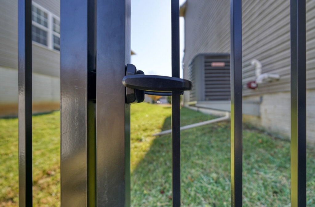 lock on black aluminum gate for safety