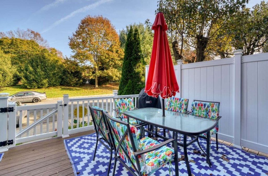 Luxury composite deck in Baltimore County with an outdoor dining area