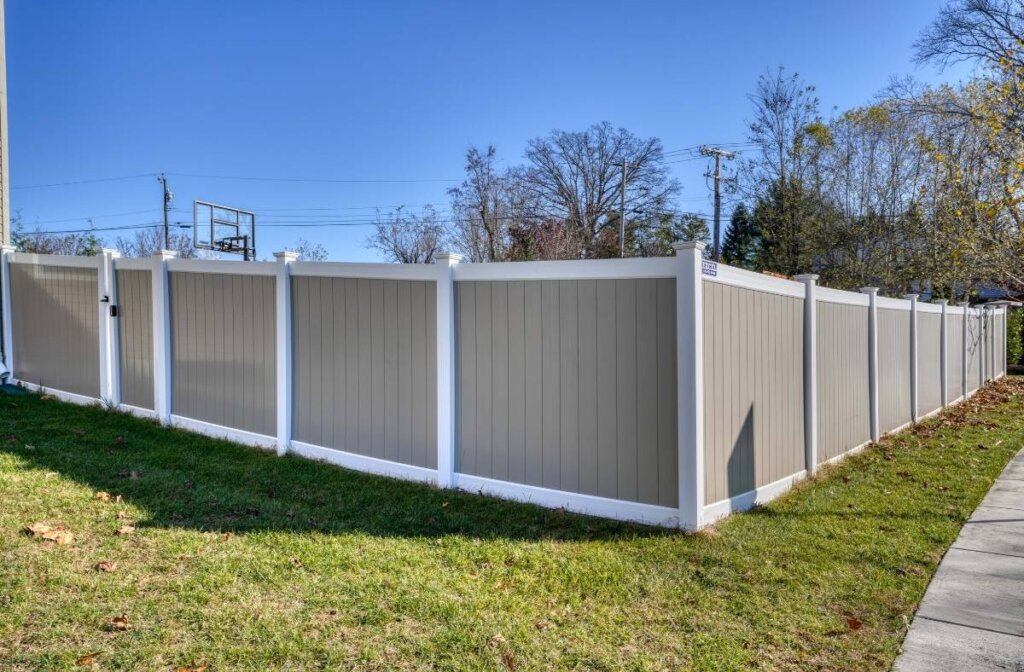 two-tone privacy fence around driveway