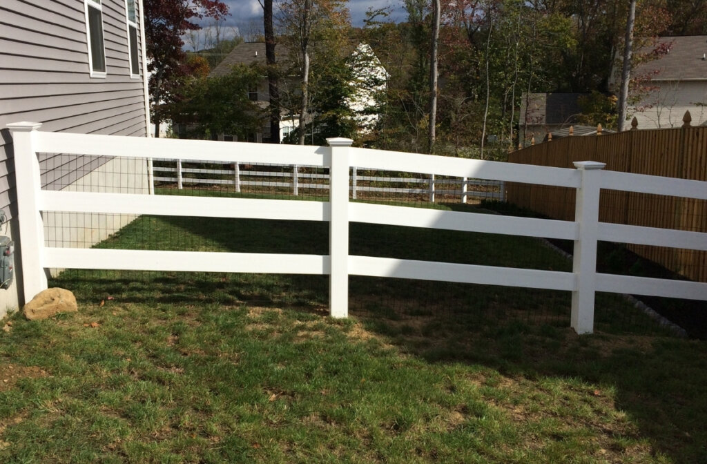 vinyl paddock fence with black wire mesh