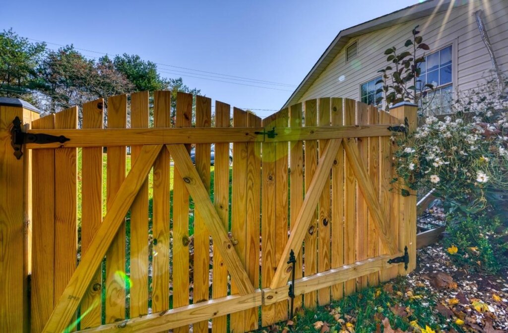 Double gate with black latches and wood finish