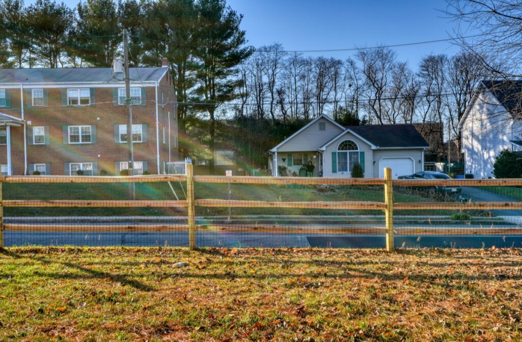 wood split rail fence with wire mesh