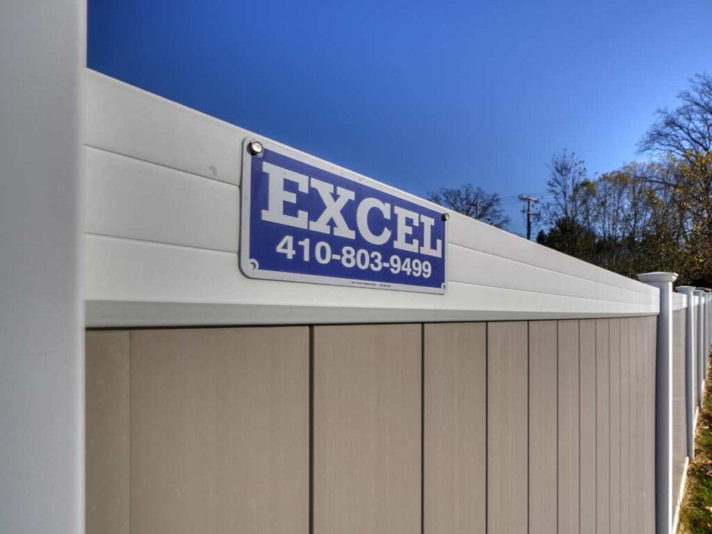 Tan and White vinyl privacy fence installed by Excel Fencing and Decking at a Bel Air, MD home.