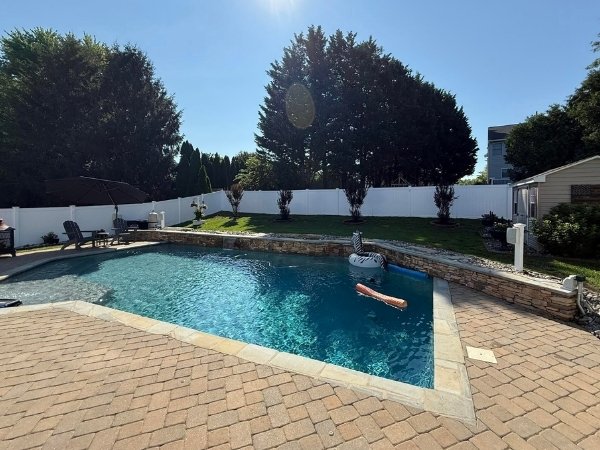 pool with a privacy fence at Excel Fencing and Decking 