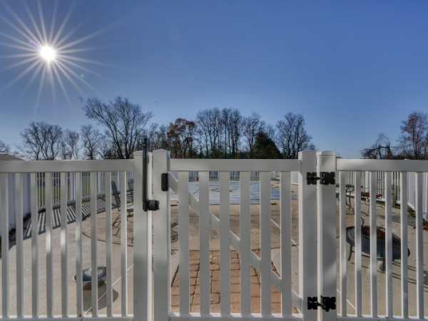 Contemporary fence and gate installed to meet Harford County Pool Code